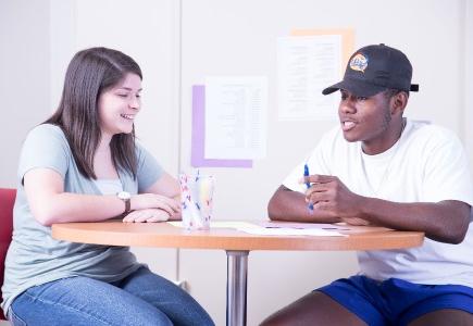 A student tutoring another student